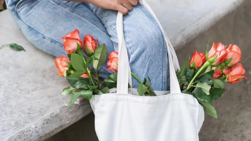 roses in a white tote bag